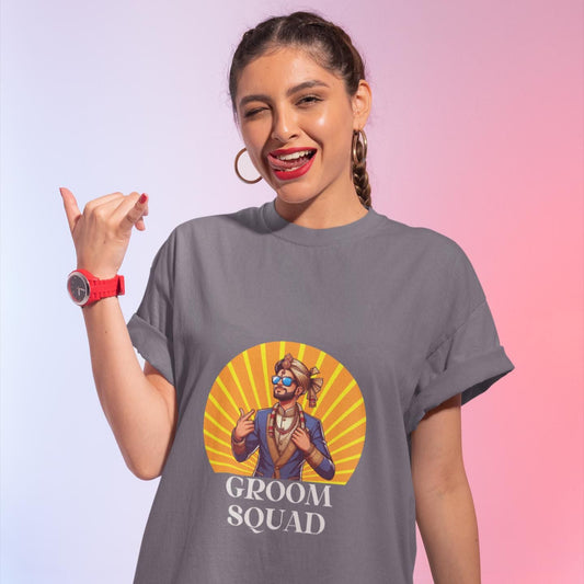Grey cotton t-shirt featuring a cartoon groom with a turban, sunglasses, and suit against a yellow sunburst, with "GROOM SQUAD" text below.