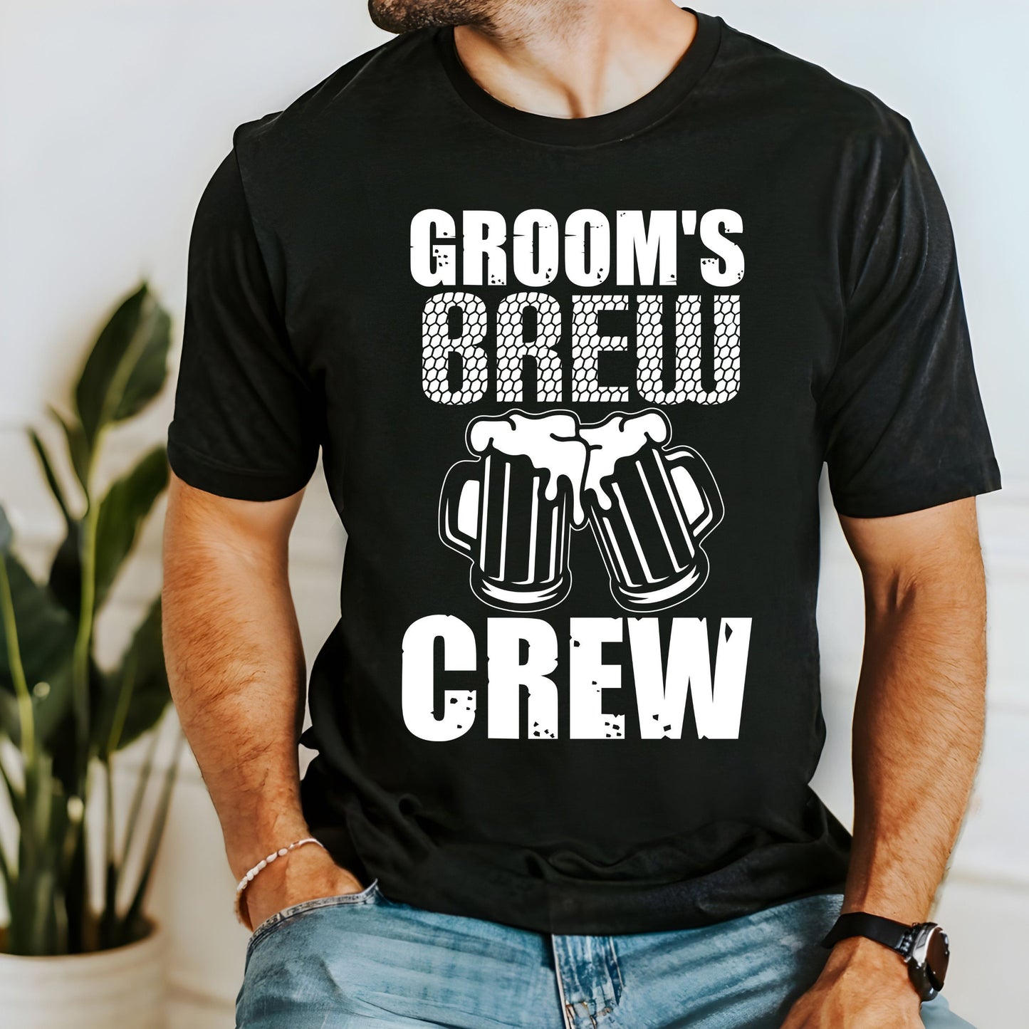 Black cotton t-shirt with white text "GROOM'S" above "BREW" in a net-like font, two overlapping beer mugs graphic, and "CREW" at the bottom.