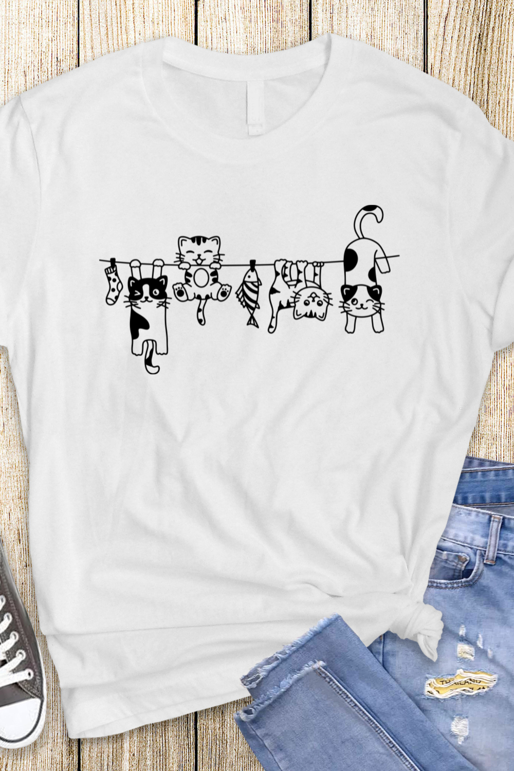 "Hanging Cats" t-shirt features a distinctive, high-quality print on premium fabric, showcasing our commitment to exceptional design and material excellence.