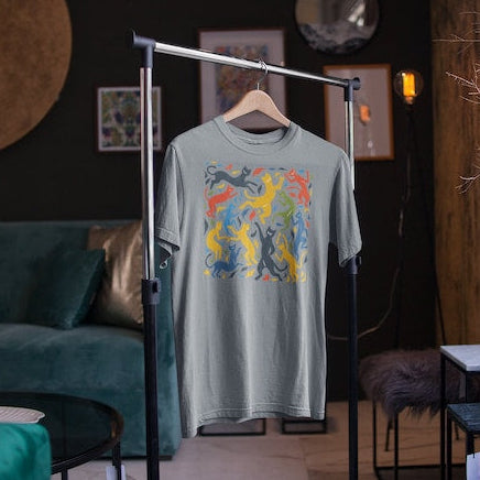 Heather Grey t-shirt on a hanger features a colorful pattern of dancing cats reminiscent of Matisse's "The Dance."
