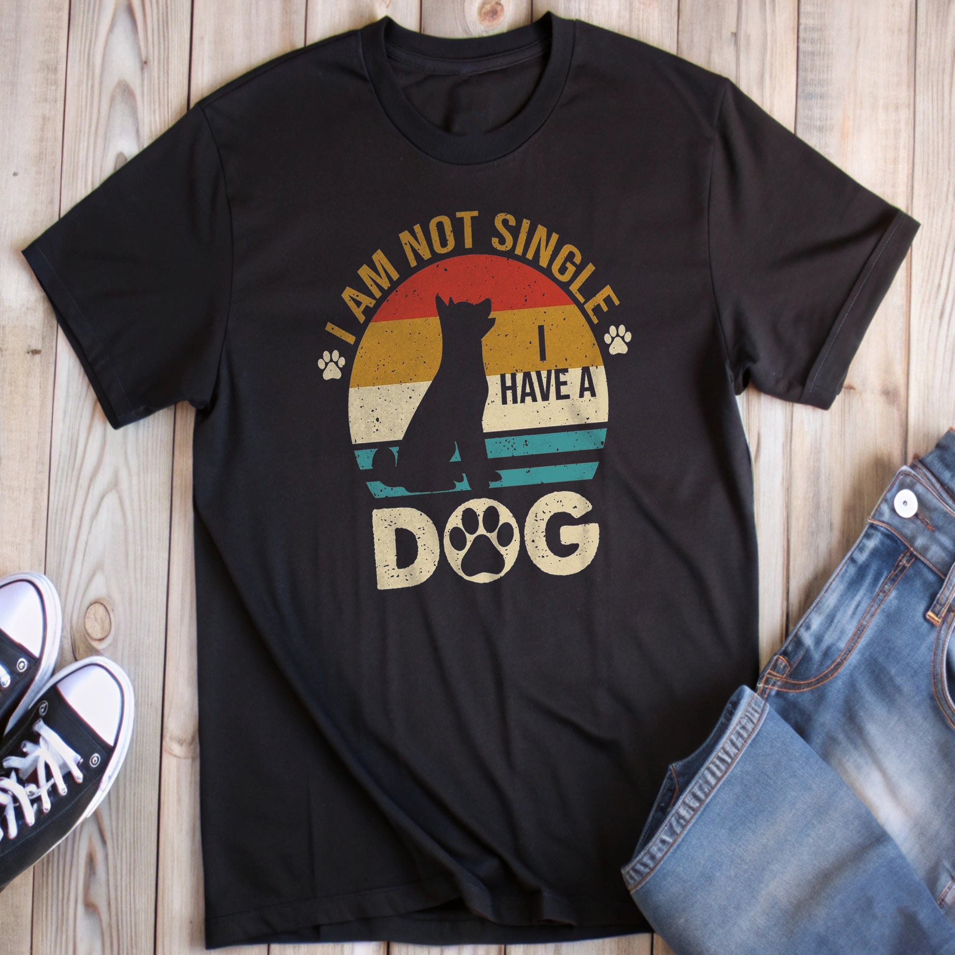 Black t-shirt with a retro sunset design, a dog silhouette, and the phrase "I AM NOT SINGLE I HAVE A DOG".