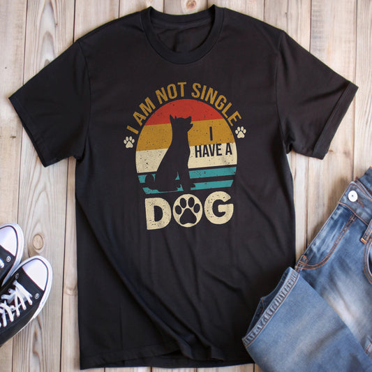 Black t-shirt with a retro sunset design, a dog silhouette, and the phrase "I AM NOT SINGLE I HAVE A DOG".