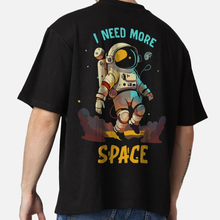 Black oversized t-shirt with an astronaut graphic and "I NEED MORE SPACE" text on the back.