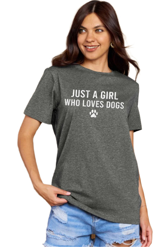 Woman wearing a gray t-shirt with the phrase "JUST A GIRL WHO LOVES DOGS" and a paw print.