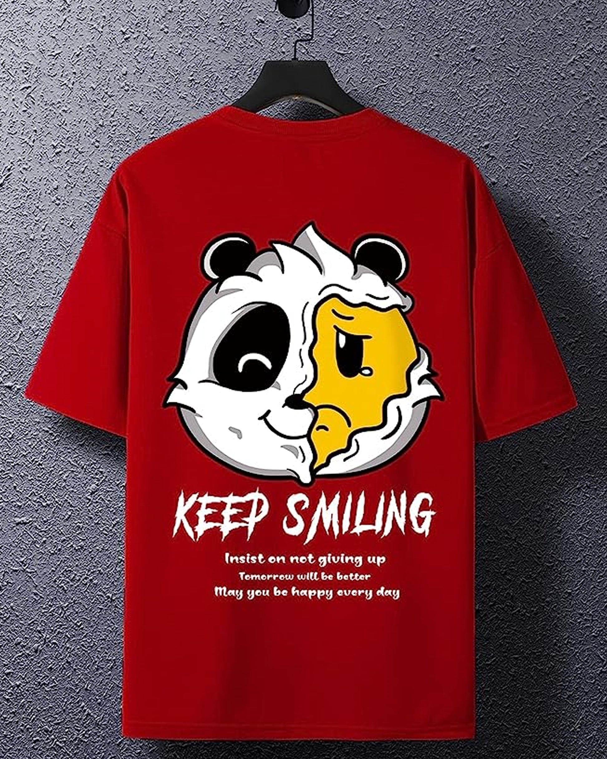 Red t-shirt with a split-faced panda graphic and "Keep Smiling" text, hanging on a black hanger.