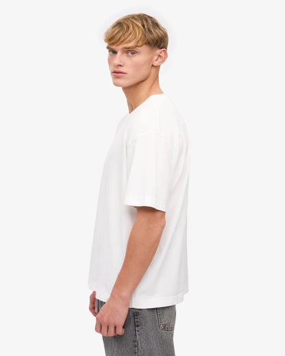 Left Side View of White Oversize T-Shirt & Grey Jeans