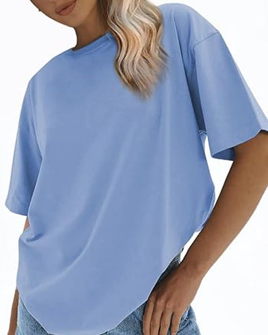 Tilted view of a person with long blonde hair wearing a light blue oversized t-shirt.