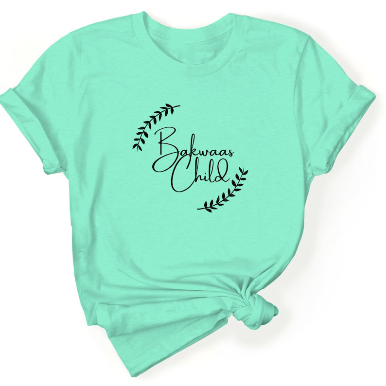 Lime Green t-shirt featuring the text "Bakwaas Child" in a stylish font, accompanied by leaf graphics.