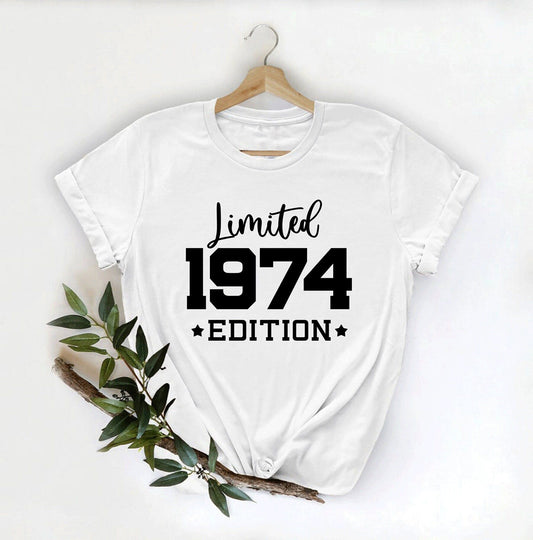 White t-shirt with "Limited Edition 1974" in bold black lettering.  Celebrates a significant 1974 milestone with a classic, stylish design.