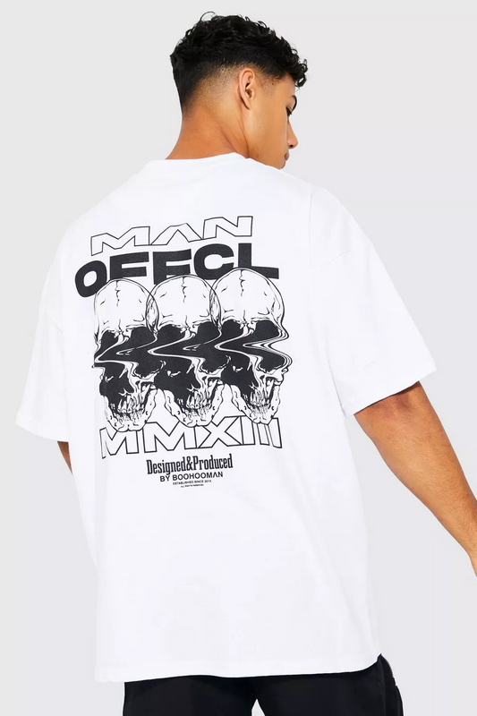 Light-colored oversize t-shirt with "Man Official" text, three distorted skull graphics, and "MMXXIII Designed & Produced by BoohooMan" text on the back.