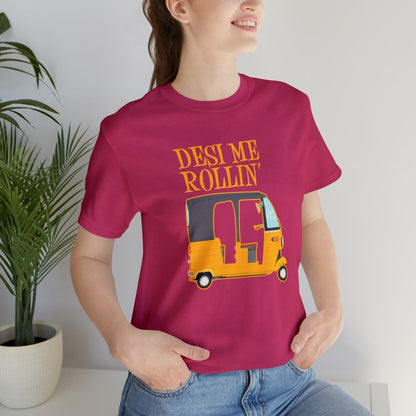 A smiling woman models a maroon t-shirt with a yellow auto rickshaw graphic and the text "Desi Me Rollin'".