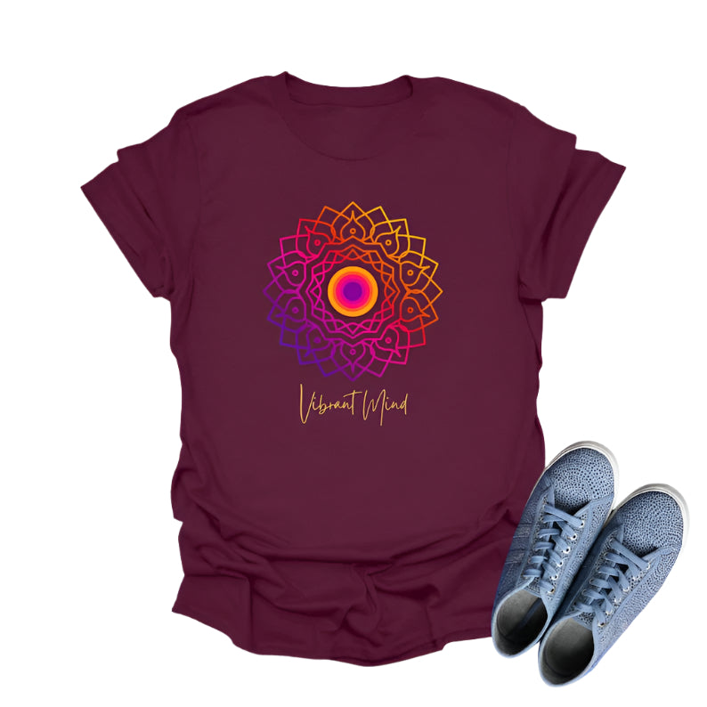 Maroon t-shirt displays a colorful gradient mandala graphic and the text "Vibrant Mind" in cursive.