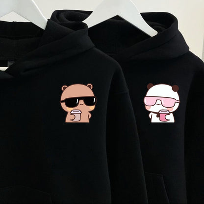 Two black hoodies with a bear wearing sunglasses and a panda with a drink design.