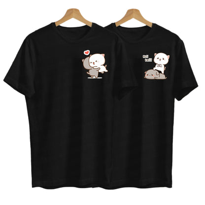 Two black t-shirts on hangers feature adorable cartoon cats in different loving poses.