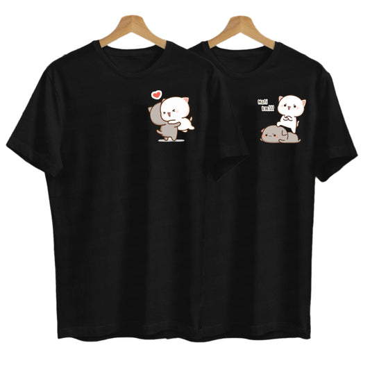 Two black t-shirts on hangers feature adorable cartoon cats in different loving poses.