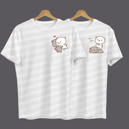 Two white t-shirts on hangers feature adorable cartoon cats in different loving poses.