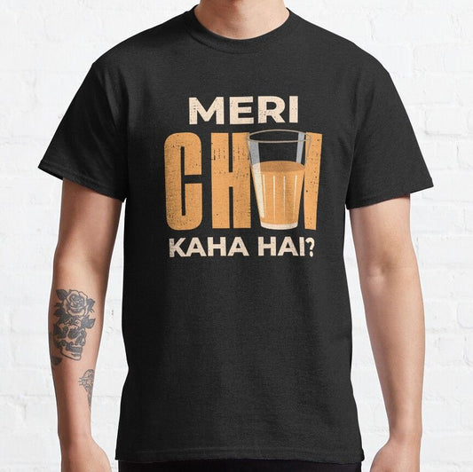 Black t-shirt with "Meri Chai Kaha Hai?" text and a glass of chai graphic. A humorous design for chai lovers with a connection to Hindi.