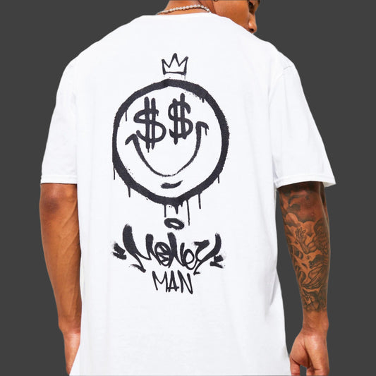 White oversize t-shirt with a black graffiti-style smiley face graphic featuring dollar signs for eyes, a crown above, and "Money Man" text below on the back.