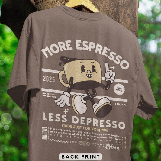 Gray t-shirt with a back print featuring a cartoon espresso cup and "More Espresso Less Depresso" text. A humorous design for espresso enthusiasts.