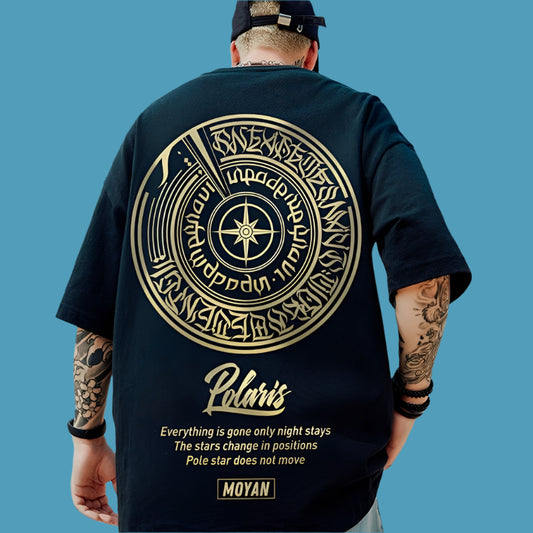  A black oversize t-shirt with a gold graphic on the back featuring a compass design, stylized text, and the word "Polaris" in cursive. A quote about stars and the moon is at the bottom, along with the "MOYAN" brand name.