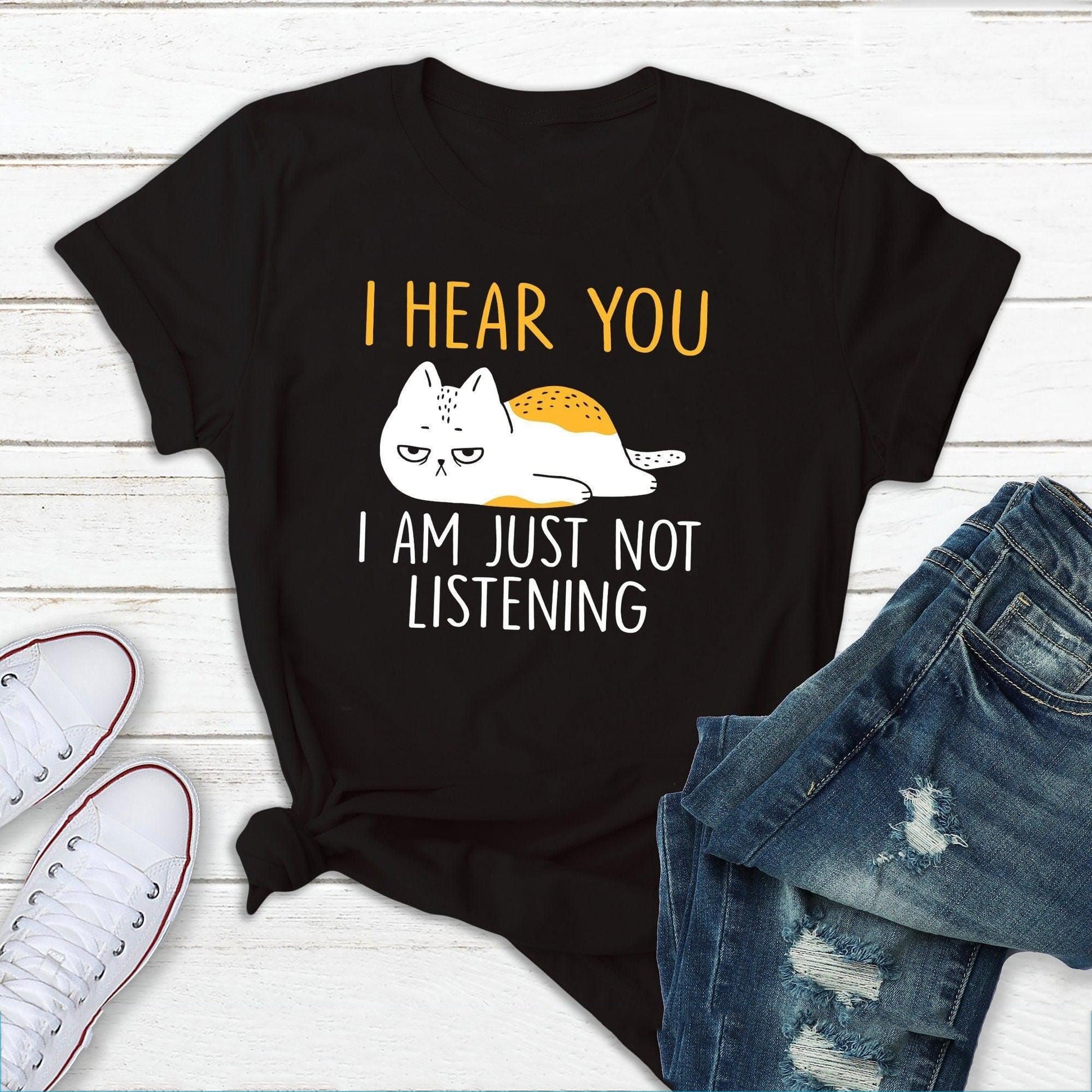 "Not Listening" t-shirt features a distinctive, high-quality print on premium fabric, showcasing our commitment to exceptional design and material excellence.