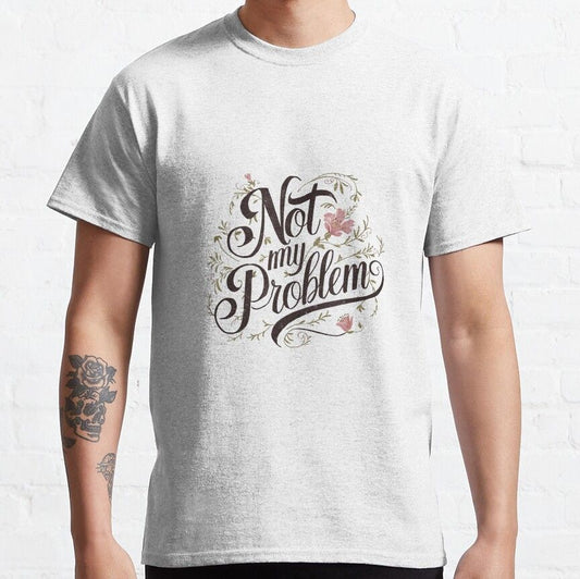Light gray t-shirt with "Not My Problem" text in a decorative script font with floral accents.