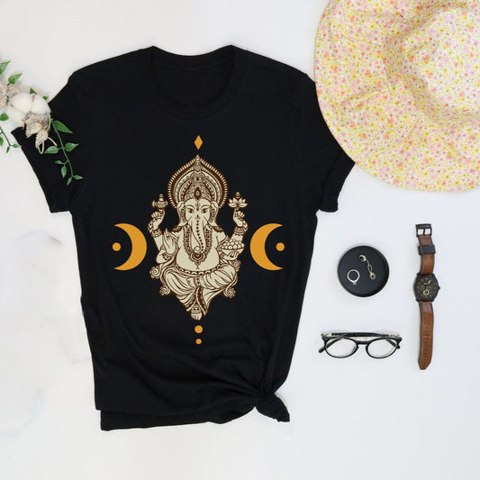 Black T-Shirt featuring a detailed, golden illustration of Lord Ganesha flanked by crescent moon symbols.