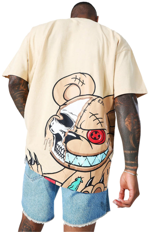 Beige oversized t-shirt with a large graphic of a teddy bear with a skull face, stitches, and a red button eye on the back. 