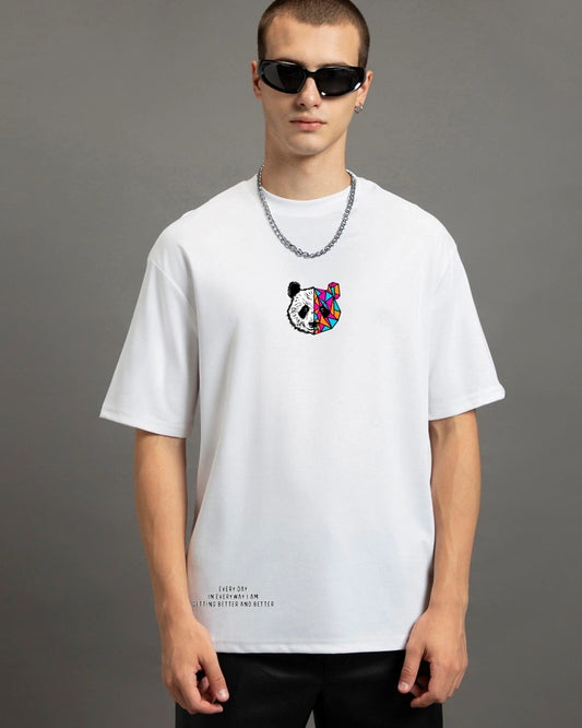  A person with dark hair and sunglasses wears a white t-shirt with a colorful panda graphic and a silver chain necklace.