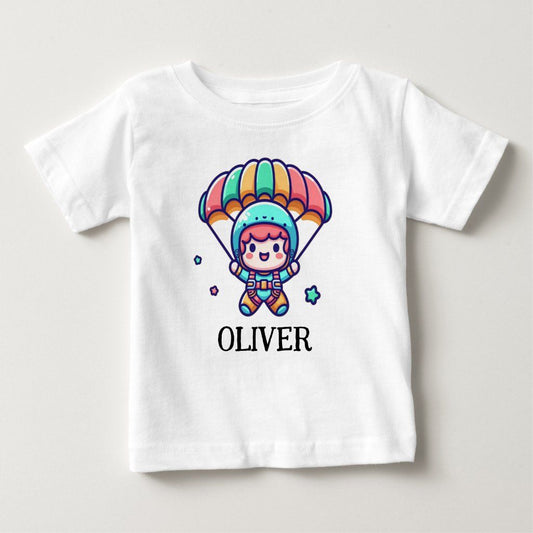 White t-shirt with a cartoon parachutist and the name "Oliver" printed below.