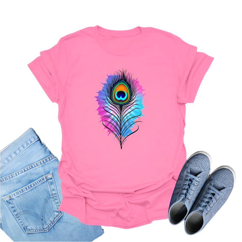 Pink t-shirt featuring a colorful watercolor-style graphic of a peacock feather.