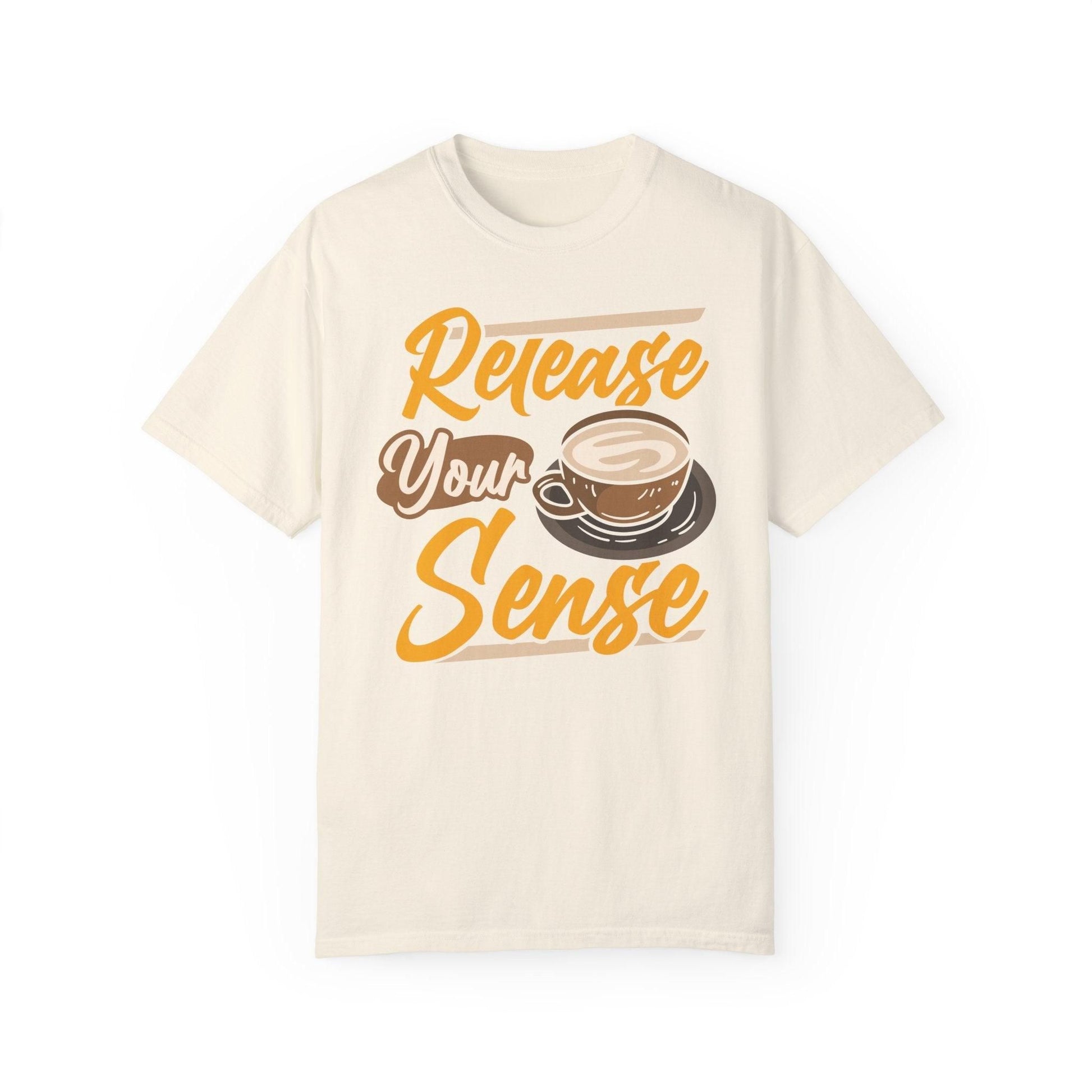 Light beige t-shirt with "Release Your Sense" text and a coffee cup graphic. A simple design for coffee enthusiasts.