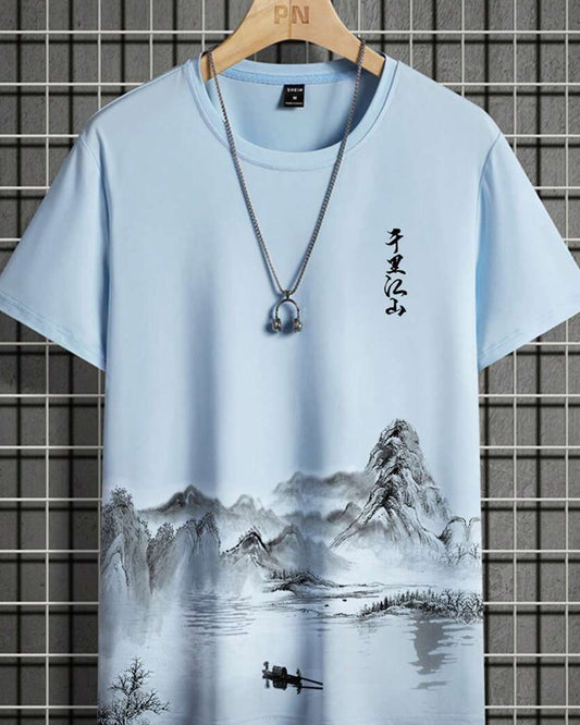 Light blue t-shirt with a landscape painting featuring mountains and Asian calligraphy, displayed with a silver necklace.