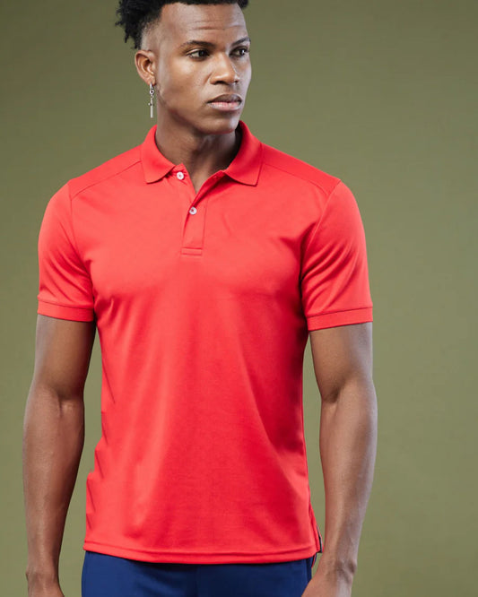A men with dark skin and short sleeves T-shirt polo t-shirt.