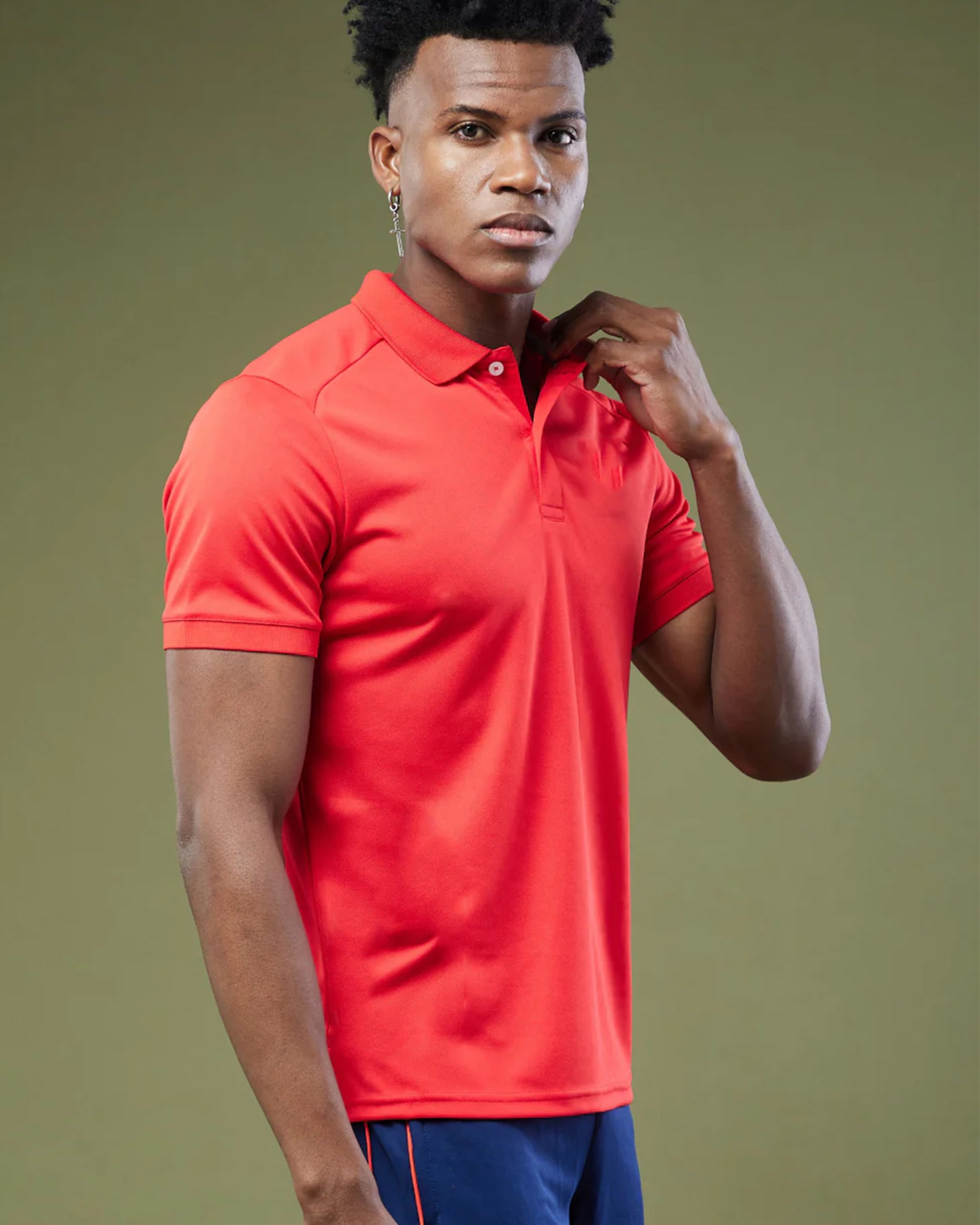Stylish_Men_in_Red_Performance_Polo_T-shirt in a side view