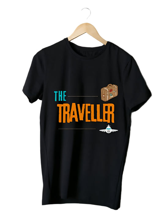 Black short-sleeved t-shirt with "THE" in teal, "TRAVELLER" in orange, a suitcase, and an airplane graphic.