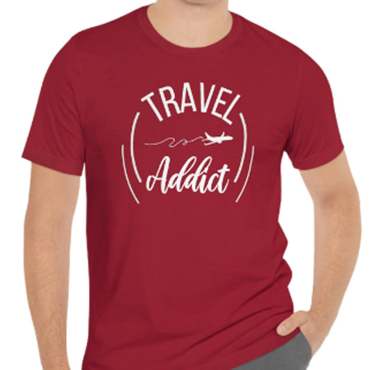 Maroon t-shirt with white text "TRAVEL Addict" and a stylized airplane trail graphic.