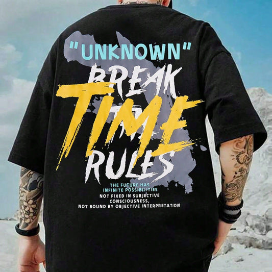 Dark-colored oversized t-shirt with "Unknown" and "Break Time Rules" graphics on the back, along with text and abstract shapes.