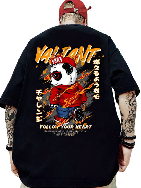 Dark-colored oversize t-shirt with a panda graphic wearing a red hoodie and cap, "Valiant" and "Follow Your Heart" text, and Japanese characters on the back.