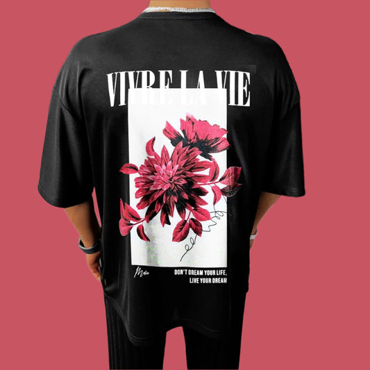 Dark-colored oversize t-shirt with "Vivre La Vie" text, a floral graphic, and "Don't Dream Your Life, Live Your Dream" text on the back.