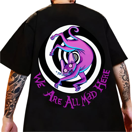 Dark-colored oversize t-shirt with a cartoon cat graphic, a spiral design, and "We Are All Mad Here" text on the back.