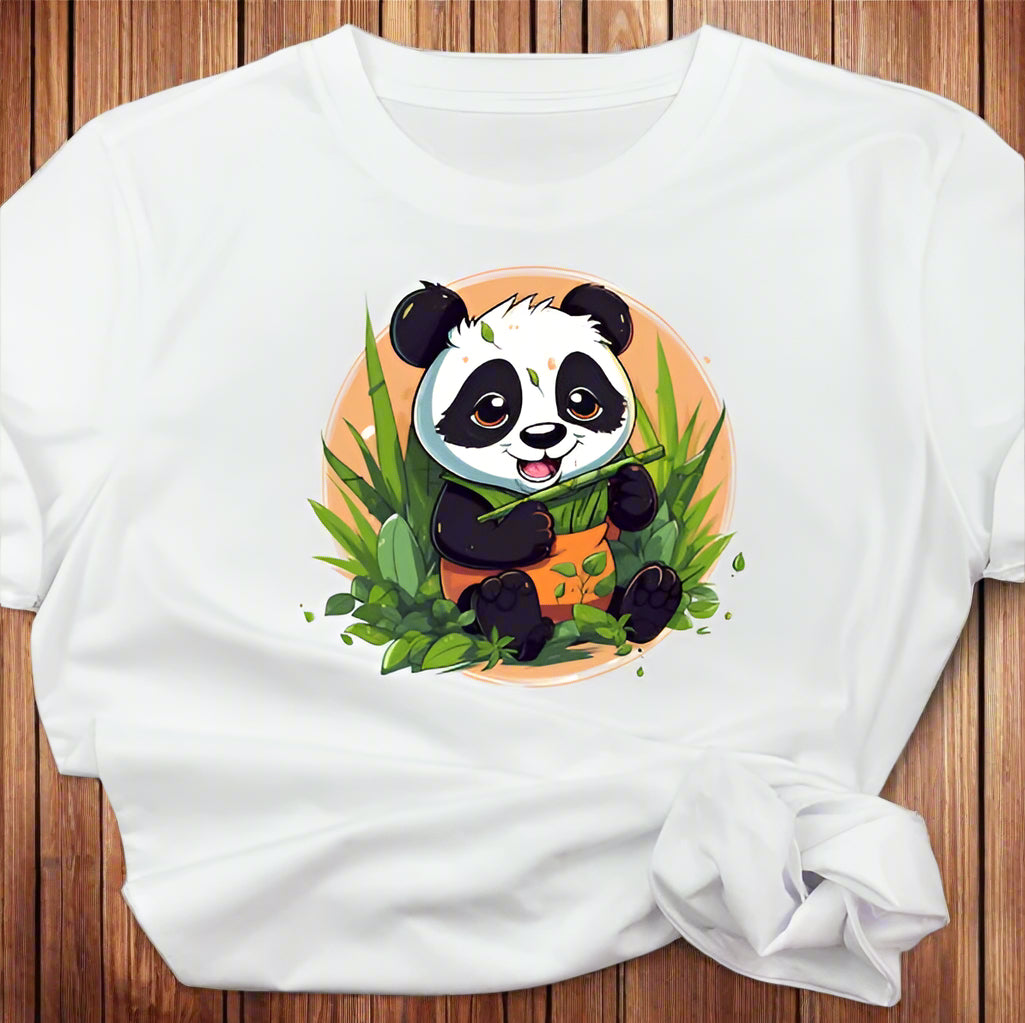 White t-shirt shows a cartoon panda sitting and happily eating green bamboo stalks.