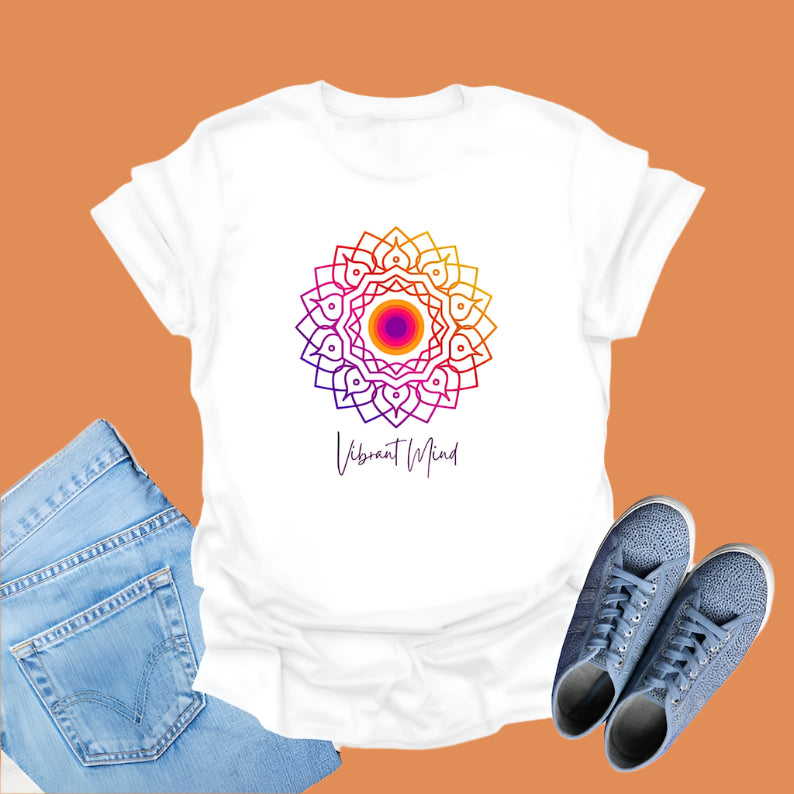 White t-shirt displays a colorful gradient mandala graphic and the text "Vibrant Mind" in cursive.