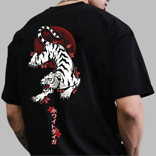 Black oversize t-shirt with a graphic of a white tiger leaping against a red circle, surrounded by red flowers. Japanese text in red is printed vertically on the left side. 