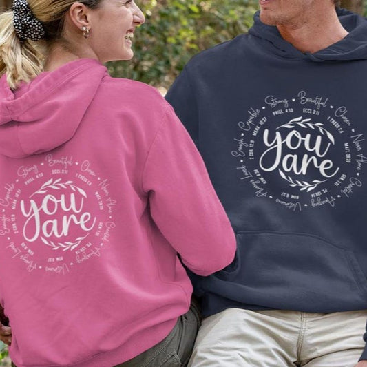 "You Are" Couple Hoodies in pink and blue, showcasing the design.