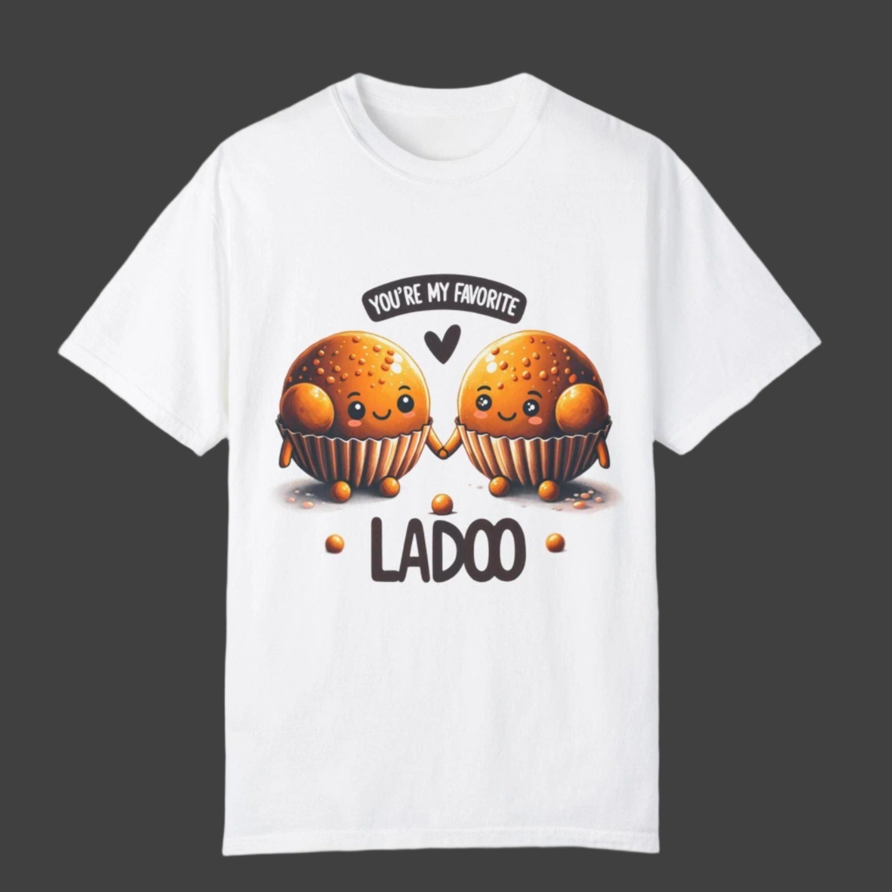 White t-shirt with two cartoon-like ladoos holding hands, the phrase "YOU'RE MY FAVORITE" in a speech bubble, and the word "LADOO" below them. Cotton blend t-shirts, available in various sizes.