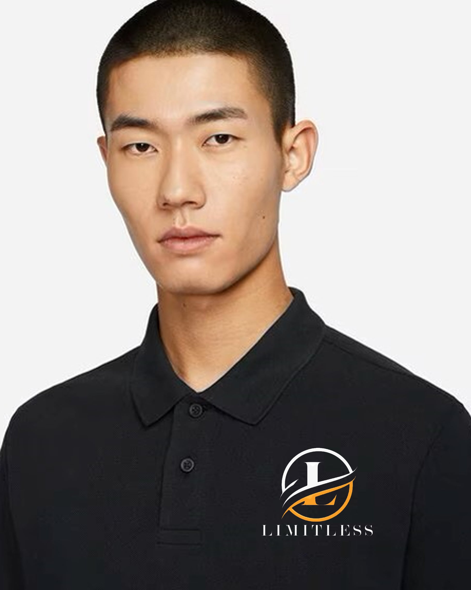 Man in a black polo t-shirt featuring the Limitless logo on chest.