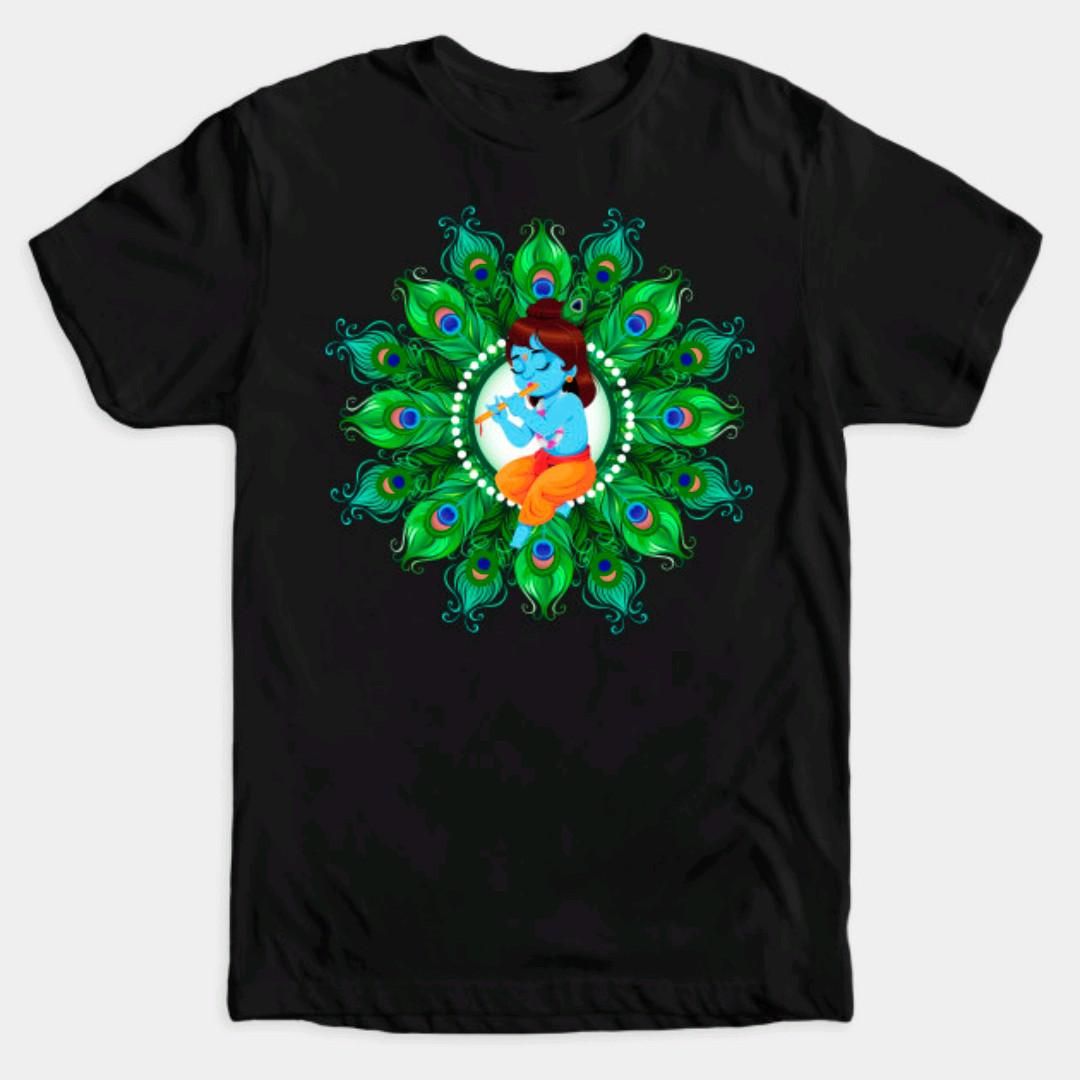Black t-shirt with a cartoon-style Bal Gopal (baby Krishna) playing the flute, surrounded by a vibrant peacock feather mandala.