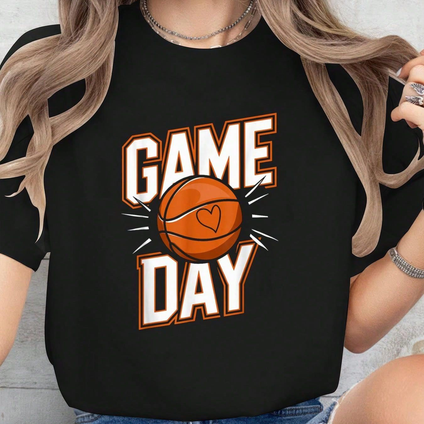 Black T-shirt featuring bold 'Game Day' text with an orange basketball and heart detail, perfect for basketball fans and game day outfits.