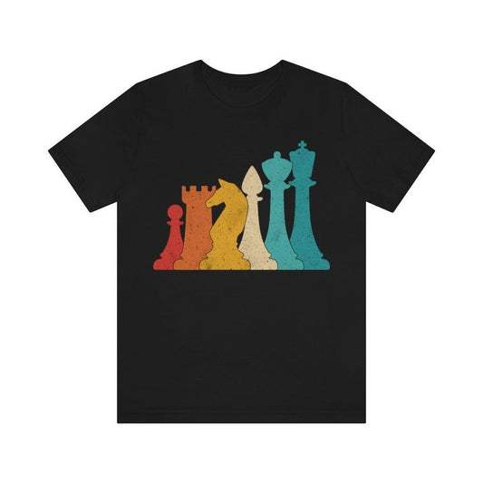 Black t-shirt featuring a colorful chess piece design with a pawn, rook, knight, bishop, and king in a vintage, distressed style.